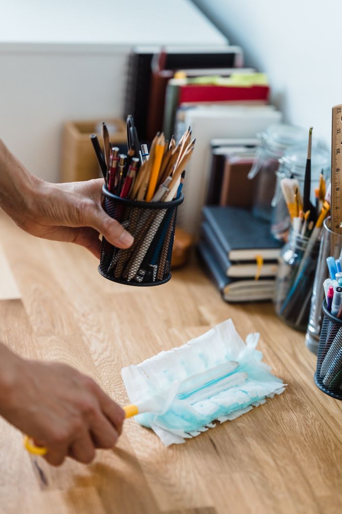 who-we-are A clean, organized desk with stationery and dusting supplies for efficient workspace.